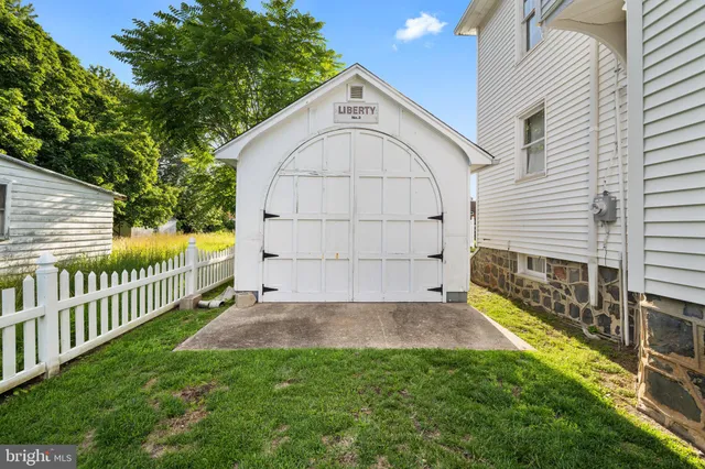 an aerial view of multiple houses with outdoor space