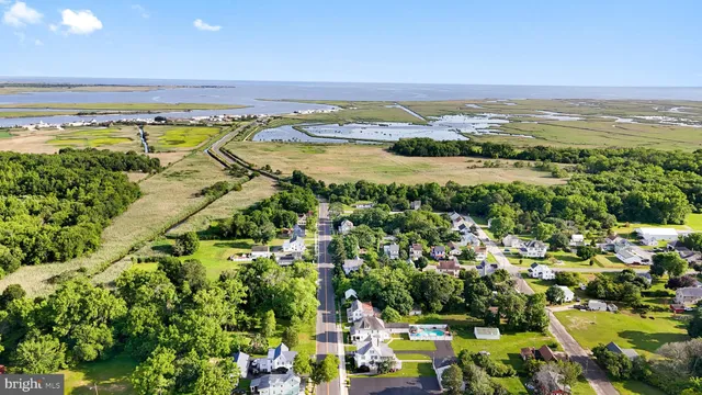 an aerial view of houses with yard