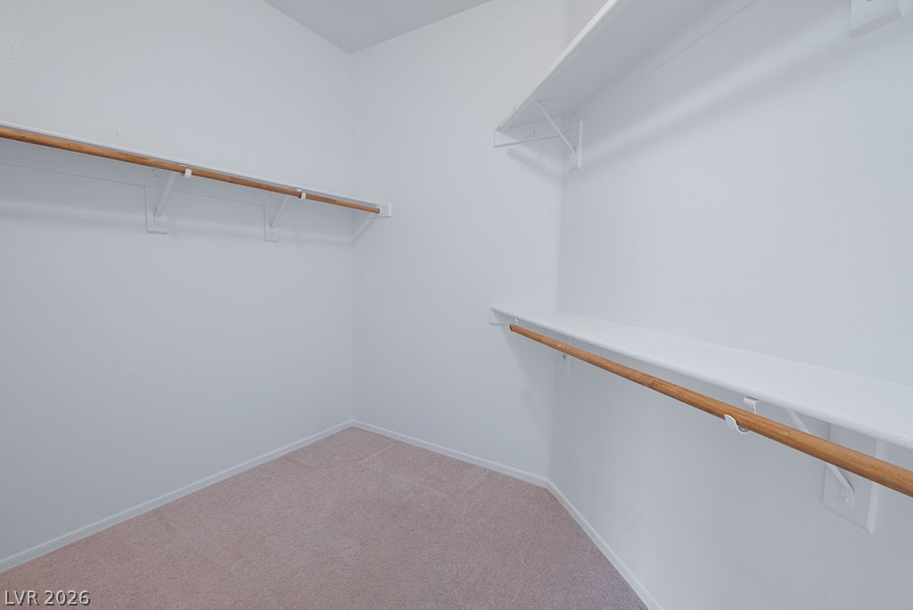 3591 Driving Range Street Las Vegas, NV 89122 - Photo 52 of 79 This spacious walk-in closet offers ample storage and organization for your wardrobe needs.