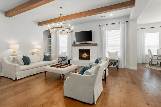 a living room with fireplace furniture and a flat screen tv