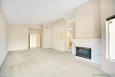 a bathroom with a granite countertop sink mirror and bathtub