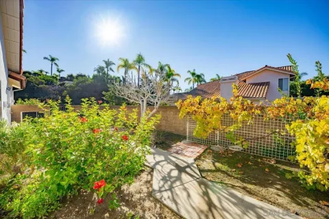 a view of a garden with a fountain