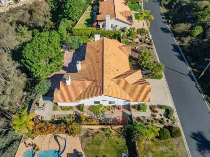 an aerial view of a house with a garden
