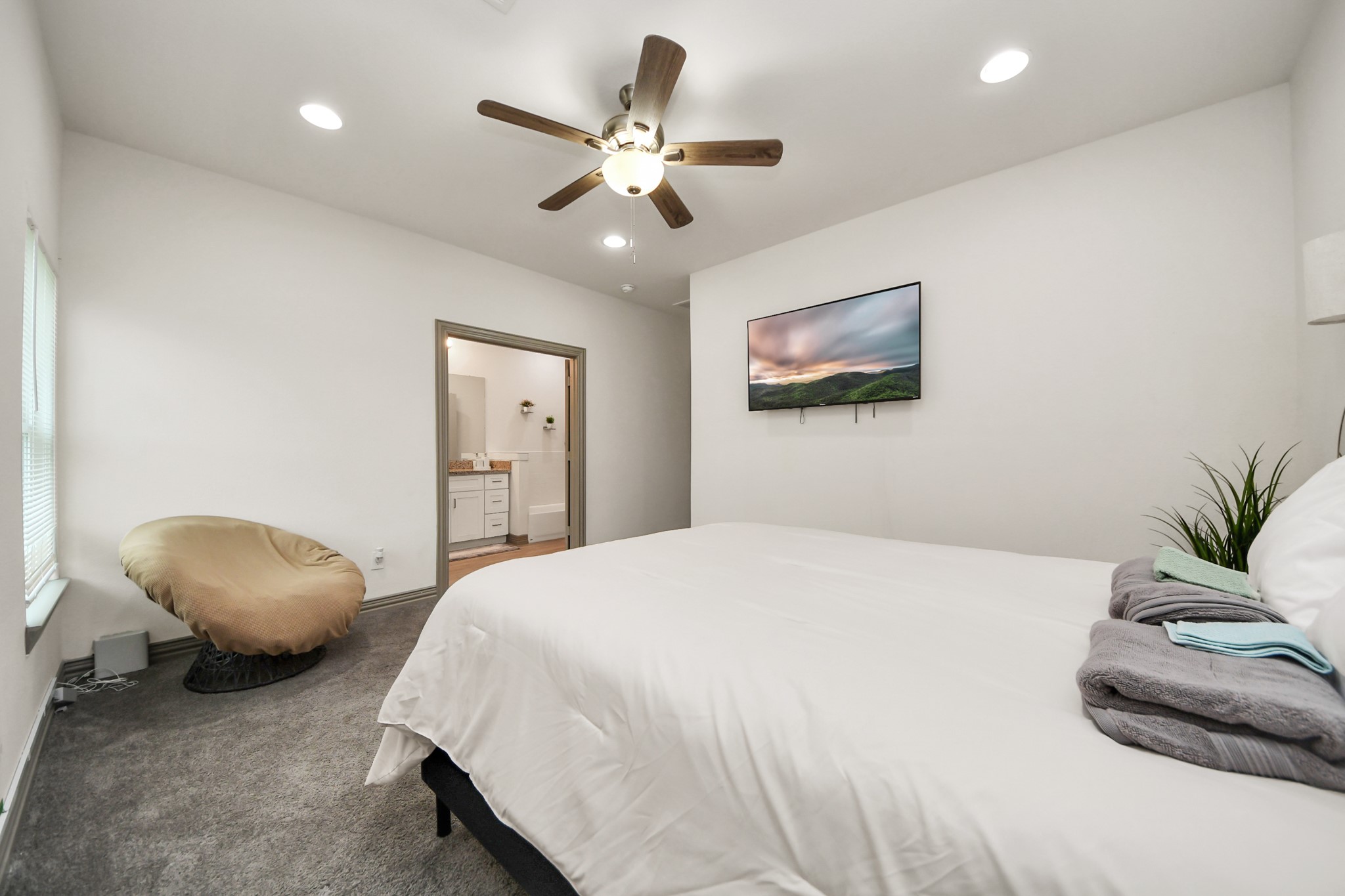 5334 Pershing Street Houston, TX 77033 - Photo 11 of 43 a bedroom with a bed and a chandelier