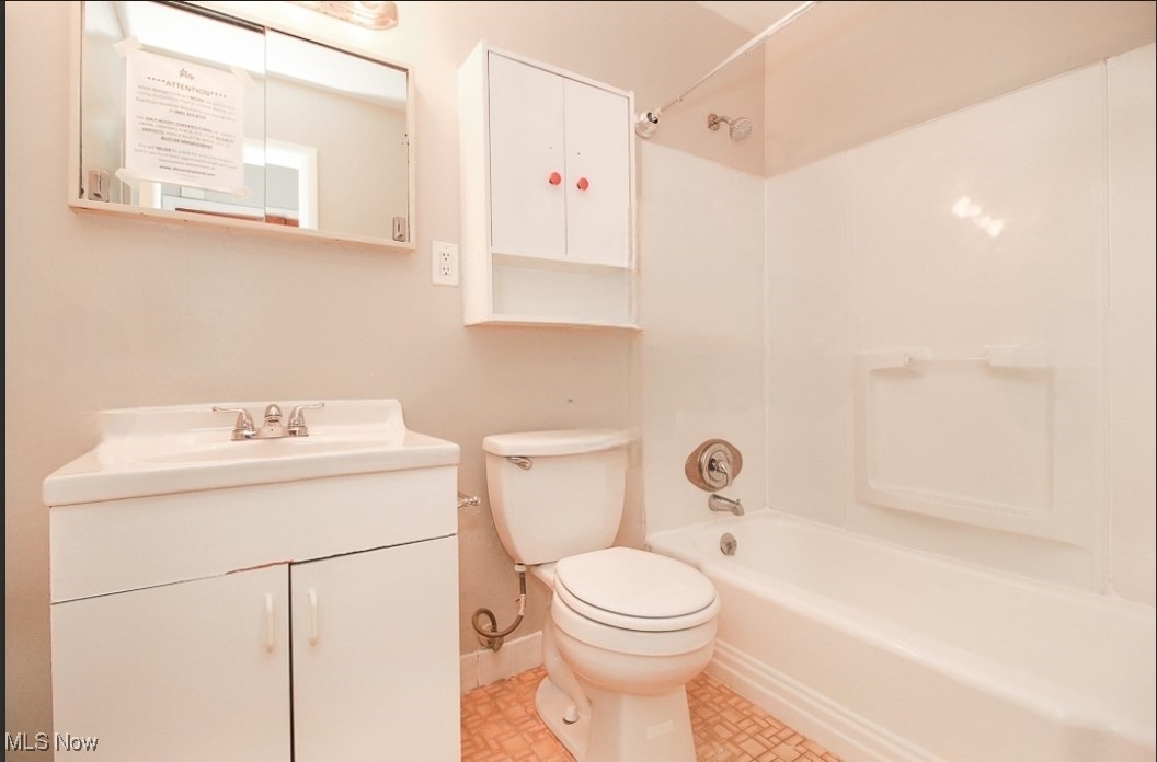 489 Harris Road Cleveland, OH 44143 - Photo 9 of 10 Full bathroom featuring vanity, toilet, and tub / shower combination