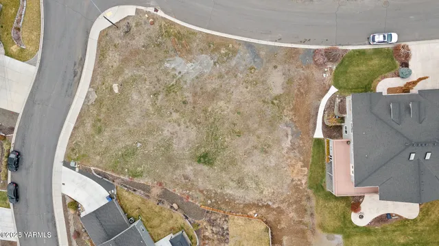 an aerial view of residential houses with city view