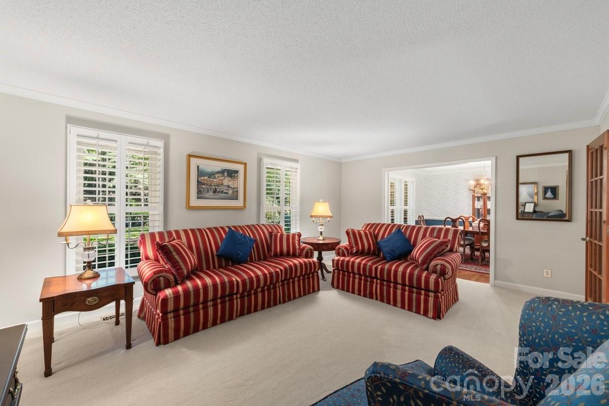 207 Lost Corner Road Morganton, NC 28655 - Photo 11 of 46 a living room with furniture ceiling fan and a window