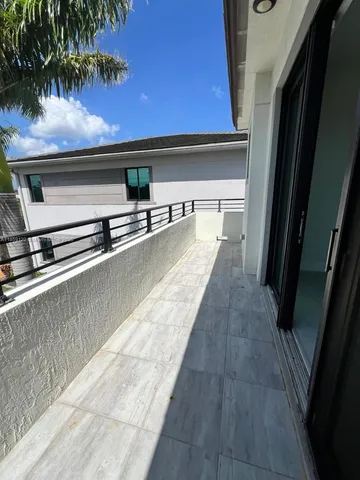 a view of a glass door and a window