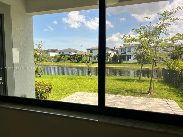 a house that has a tree in front of it