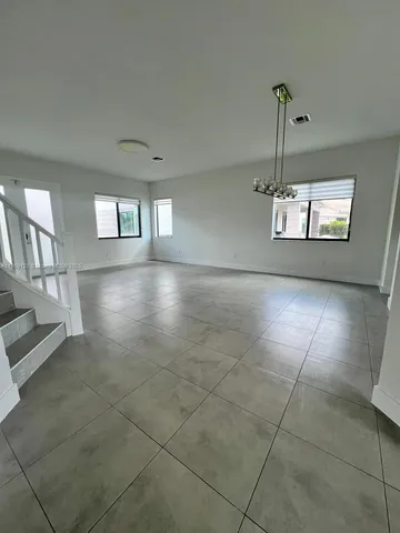 a white toilet sitting next to a sink