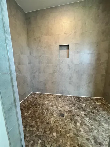 a bathroom with a double vanity sink and mirror