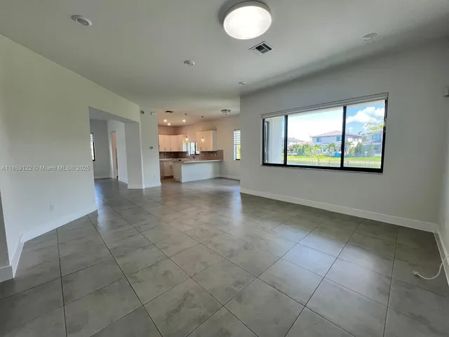 a view of a kitchen with a sink and a window