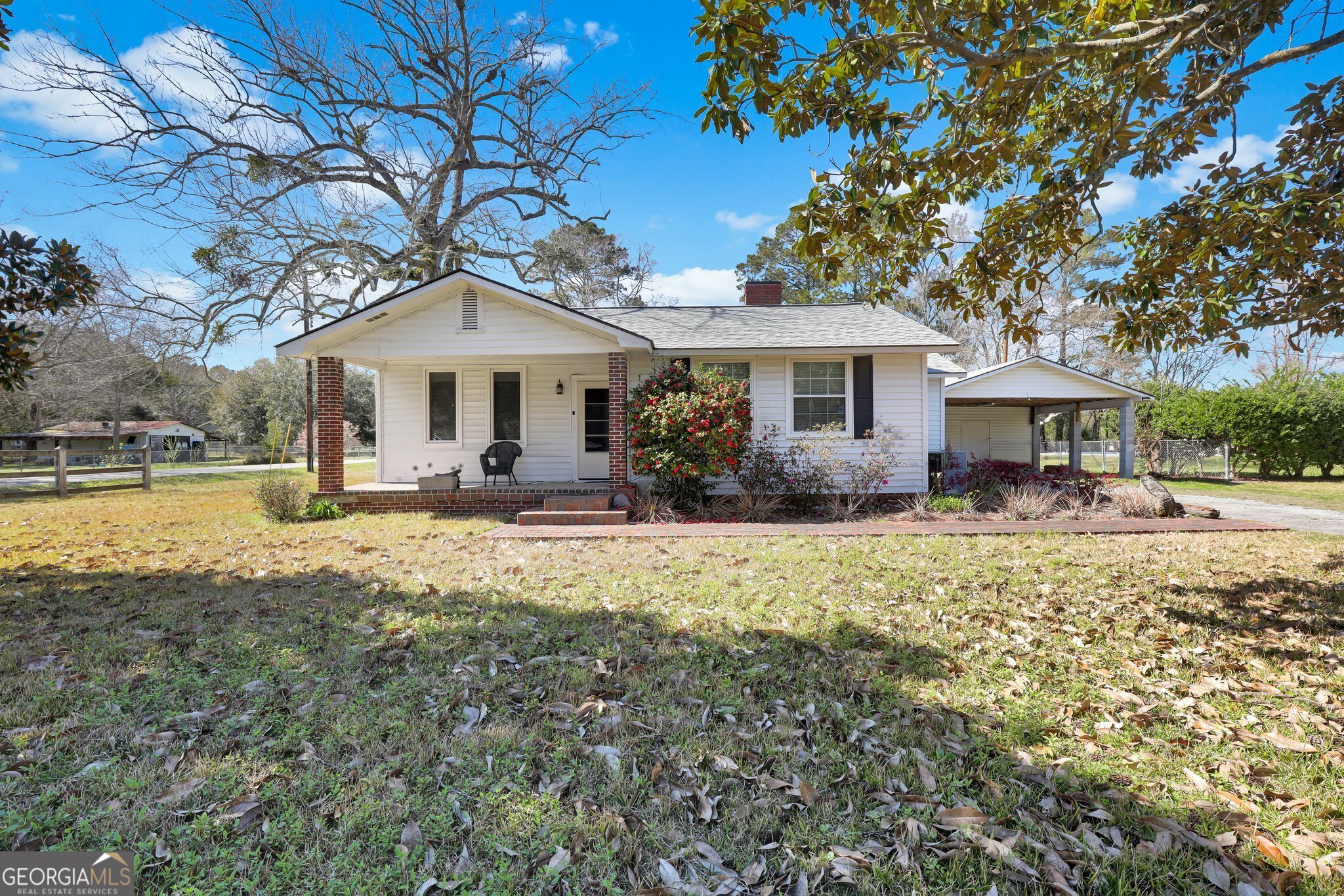 a front view of house with yard and green space