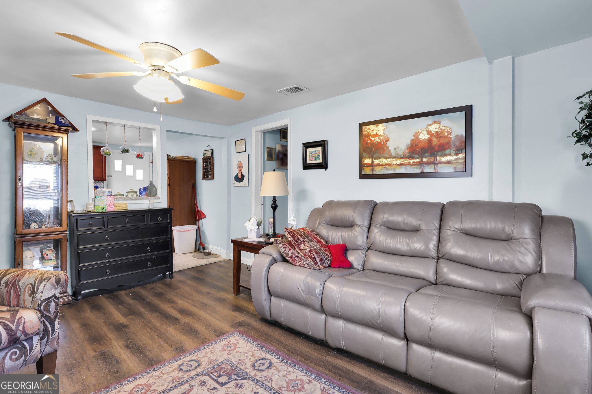 177 Spruce Street Richmond Hill, GA 31324 - Photo 13 of 15 a living room with furniture and wooden floor