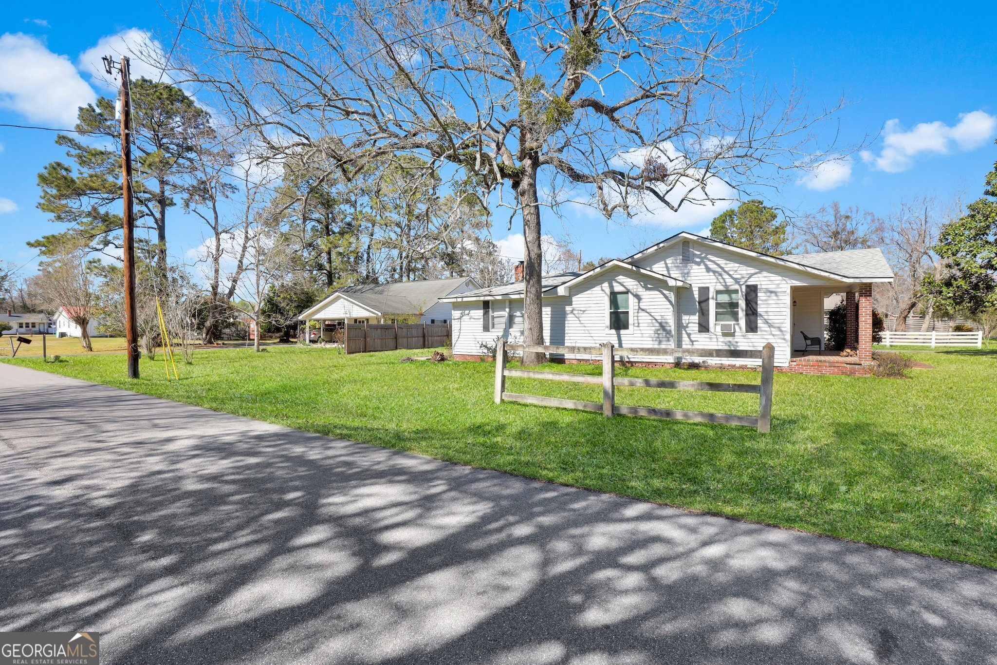 177 Spruce Street Richmond Hill, GA 31324 - Photo 15 of 15 a view of house with a garden and pathway