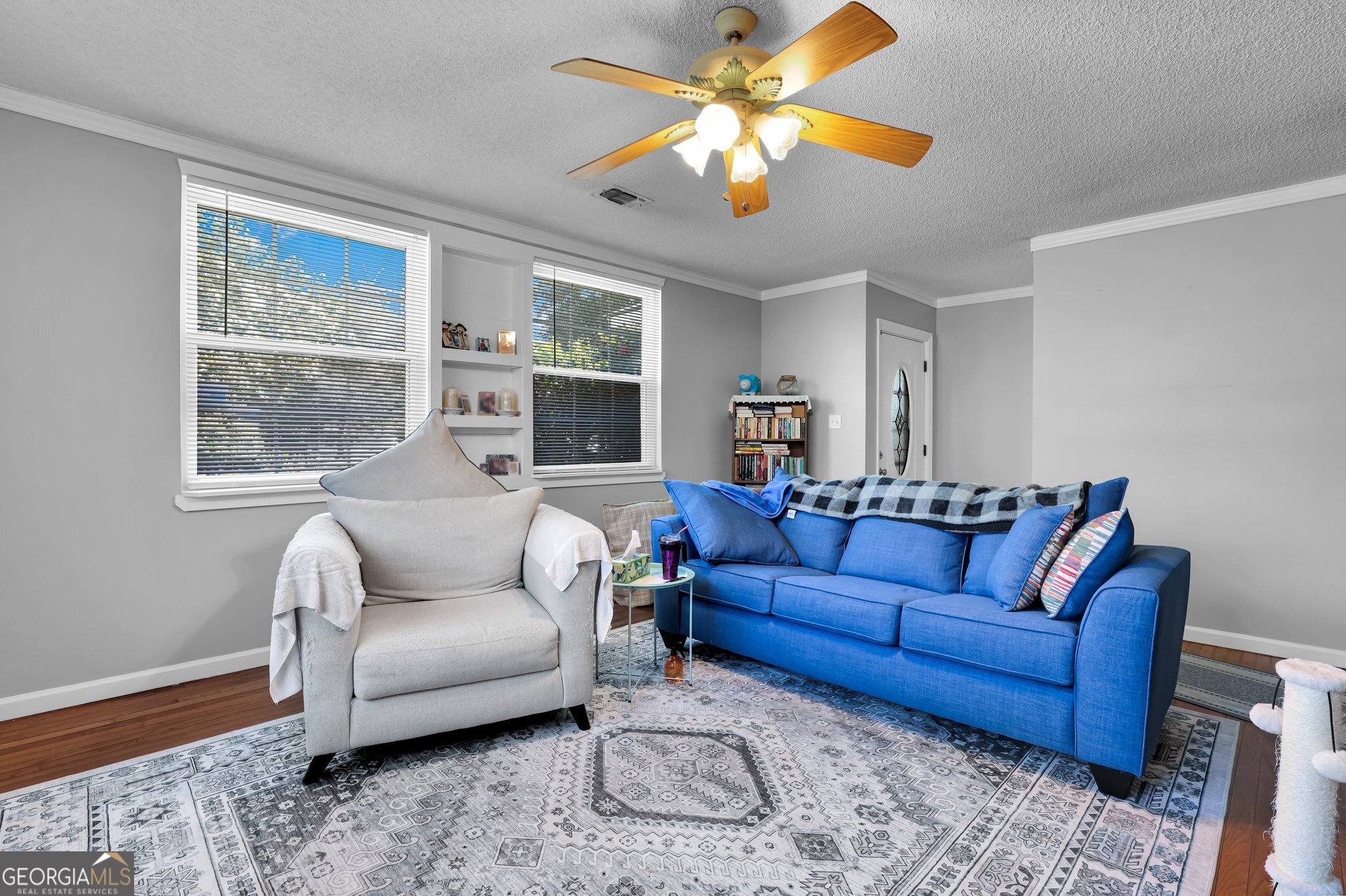 177 Spruce Street Richmond Hill, GA 31324 - Photo 6 of 15 a living room with furniture ceiling fan and a window
