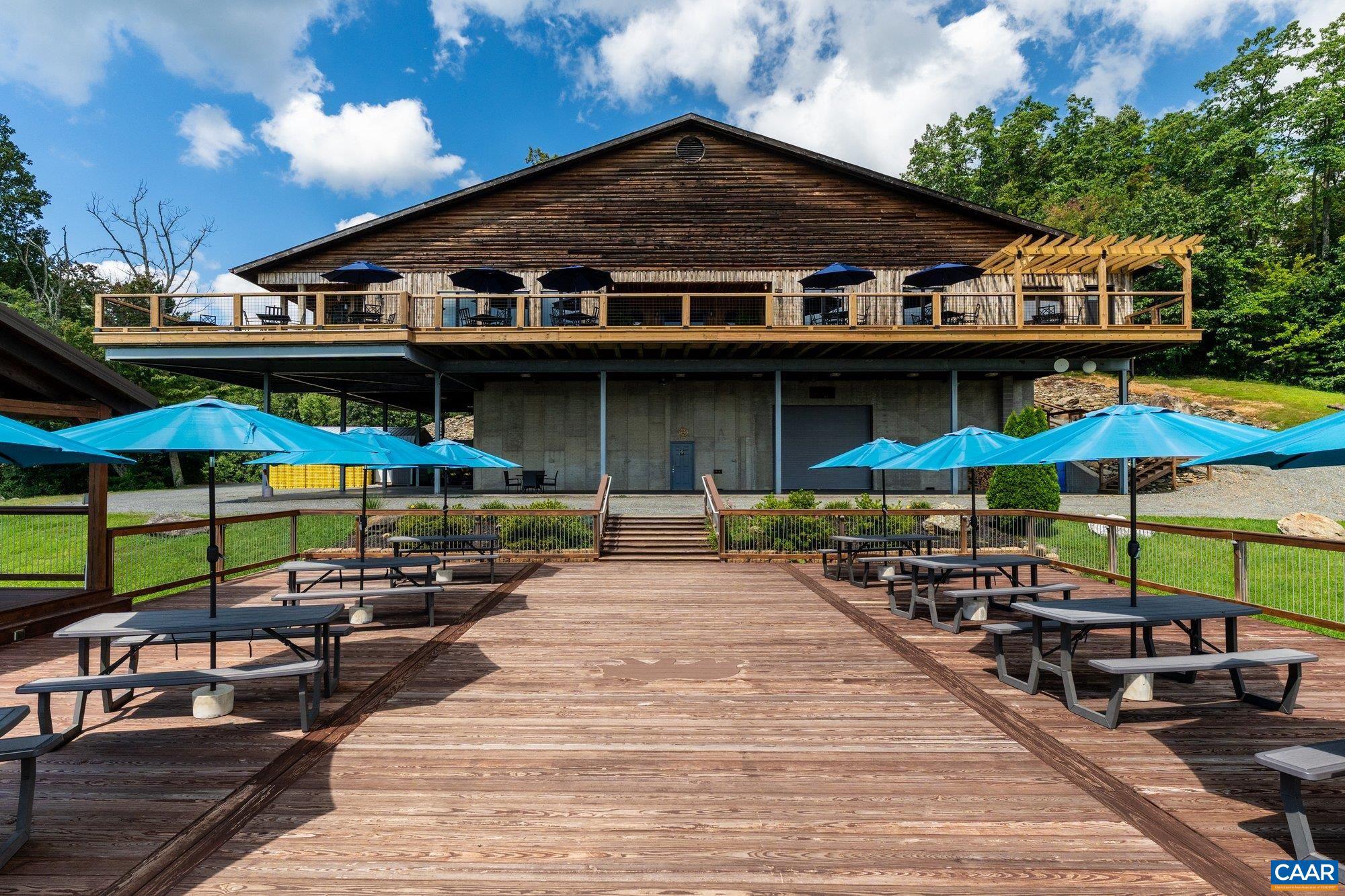 1376 A Wyatt Mountain Road Dyke, VA 22935 - Photo 12 of 58 a view of a chairs and table under an umbrella in patio