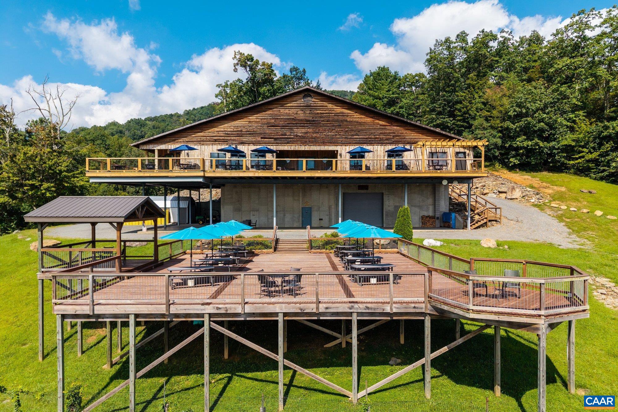1376 A Wyatt Mountain Road Dyke, VA 22935 - Photo 13 of 58 a front view of a house with swimming pool table and chairs