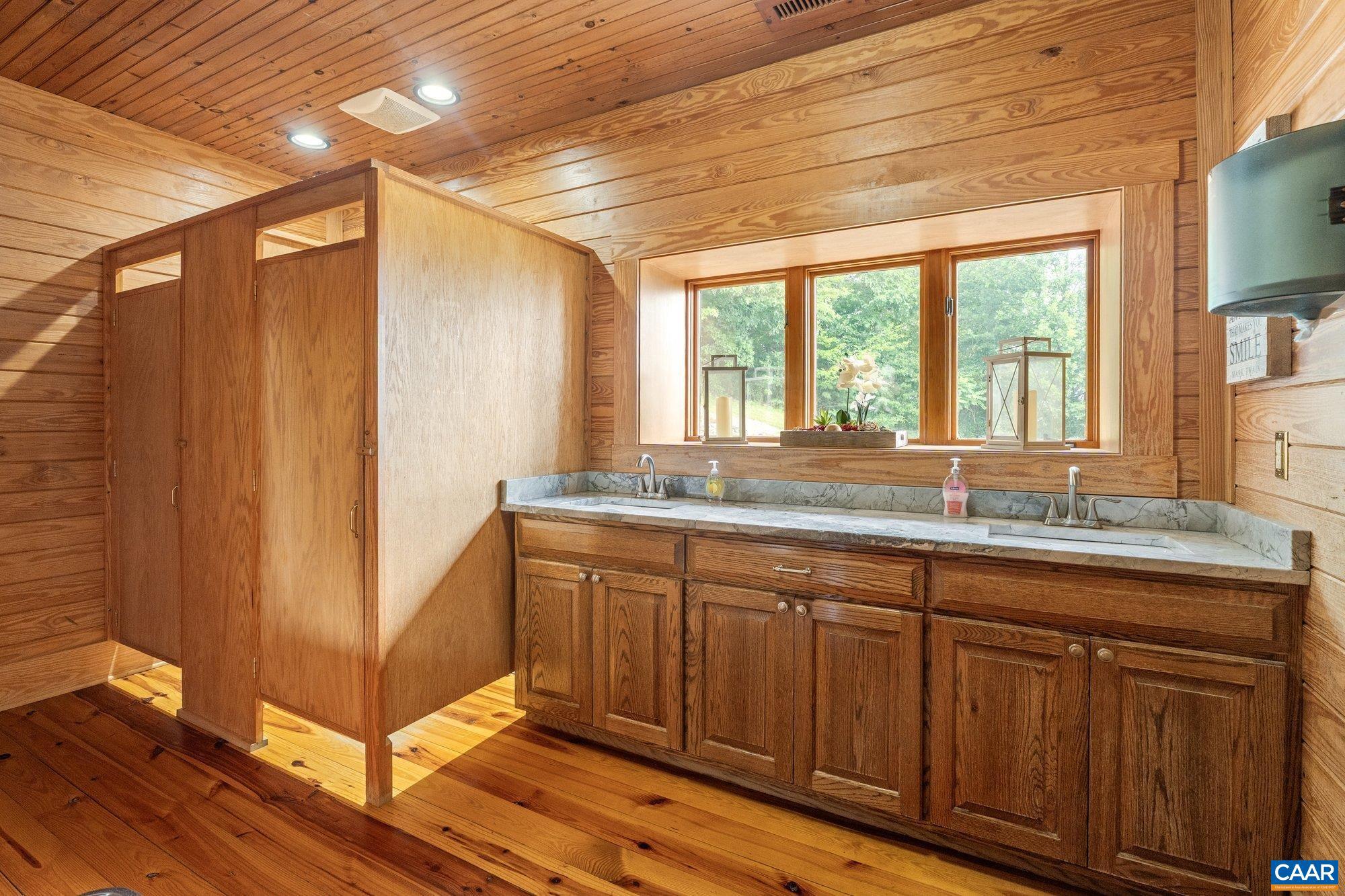 1376 A Wyatt Mountain Road Dyke, VA 22935 - Photo 37 of 58 a bathroom with sinks a vanity and a large mirror