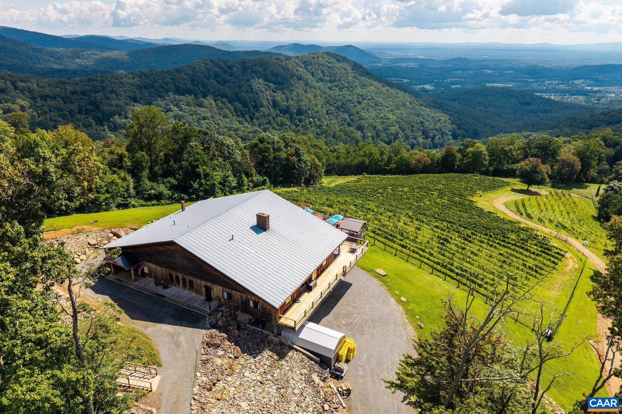 1376 A Wyatt Mountain Road Dyke, VA 22935 - Photo 5 of 58 an aerial view of a house with pool and mountain view