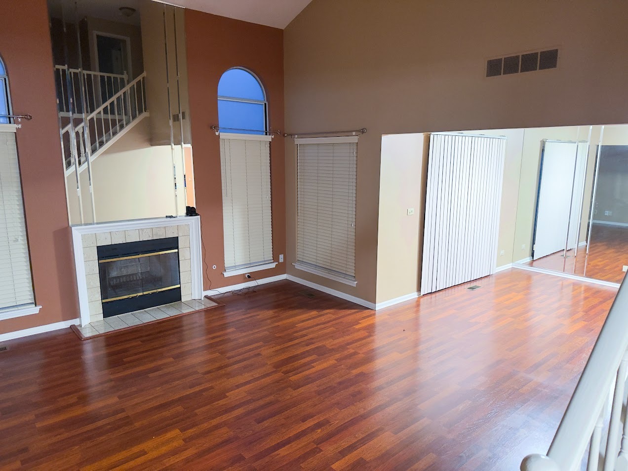 1042 Ridgefield Circle, Unit 1042 Carol Stream, IL 60188 - Photo 4 of 13 a view of a livingroom with wooden floor and staircase
