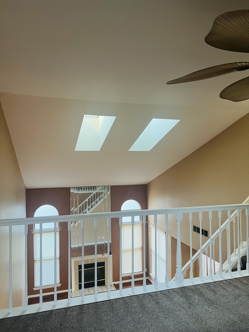 1042 Ridgefield Circle, Unit 1042 Carol Stream, IL 60188 - Photo 8 of 13 a view of staircase with white walls