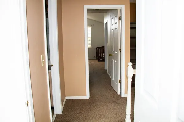 a view of a bathroom from a hallway