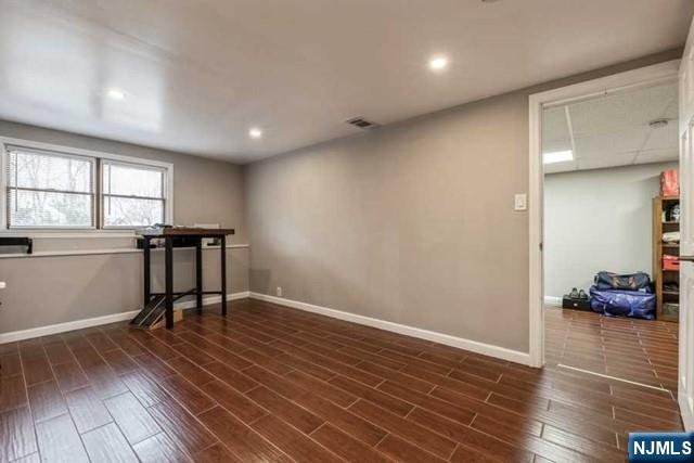 23 Asmus Road Closter, NJ 07624 - Photo 24 of 38 a view of a room with furniture and wooden floor
