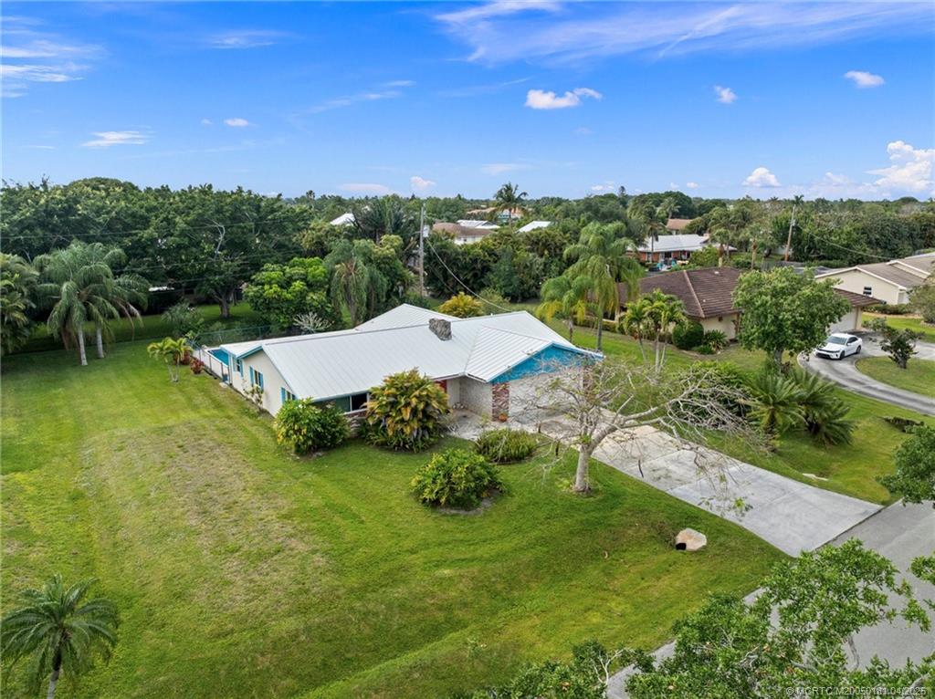 2416 North W Everglades Boulevard Stuart, FL 34994 - Photo 8 of 9 a view of a garden with an outdoor space