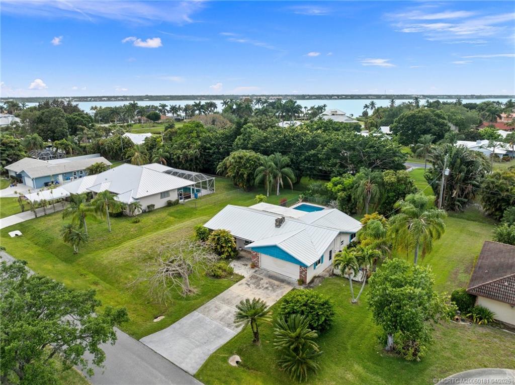 2416 North W Everglades Boulevard Stuart, FL 34994 - Photo 9 of 9 an aerial view of a house with a yard