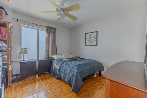 a bedroom with a bed and a cabinets