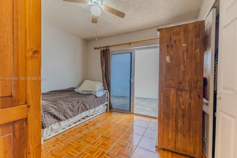 a bedroom with a bed and a shower