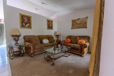 a living room with furniture and a couch