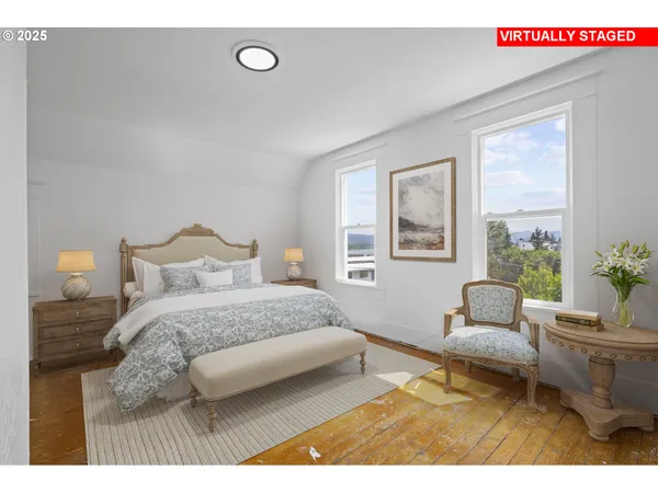 a bedroom with a bed window and couch