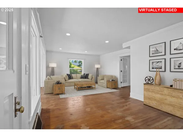a living room with furniture and a table