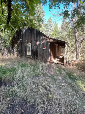 a view of a barn in the back yard
