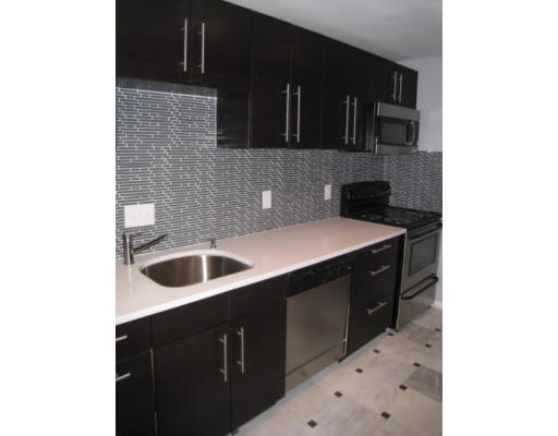16 Addington Road, Unit 43 Brookline, MA 02445 - Photo 1 of 1 a kitchen with a sink and cabinets