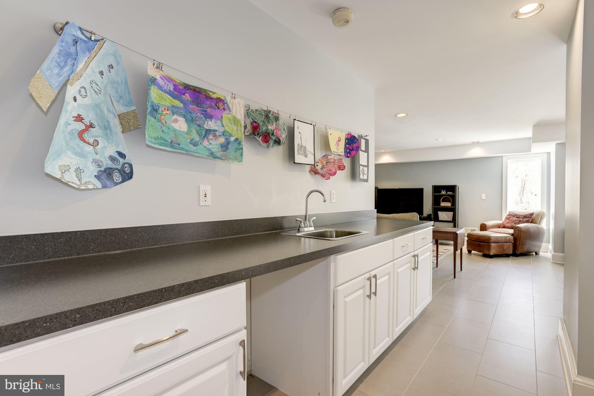1507 Stonewall Road Alexandria, VA 22301 - Photo 20 of 29 Wet bar with wine fridge on lower level.