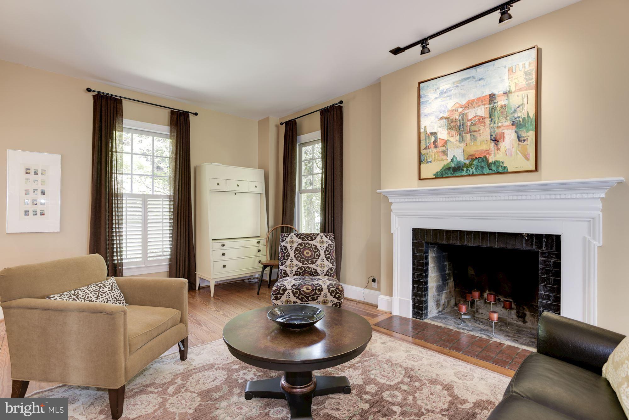 1507 Stonewall Road Alexandria, VA 22301 - Photo 5 of 29 Cozy up to the warm fireplace in the living room.