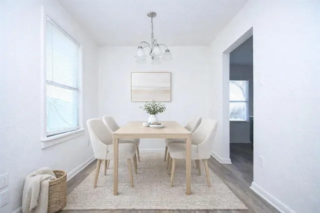 a dining room with furniture and window