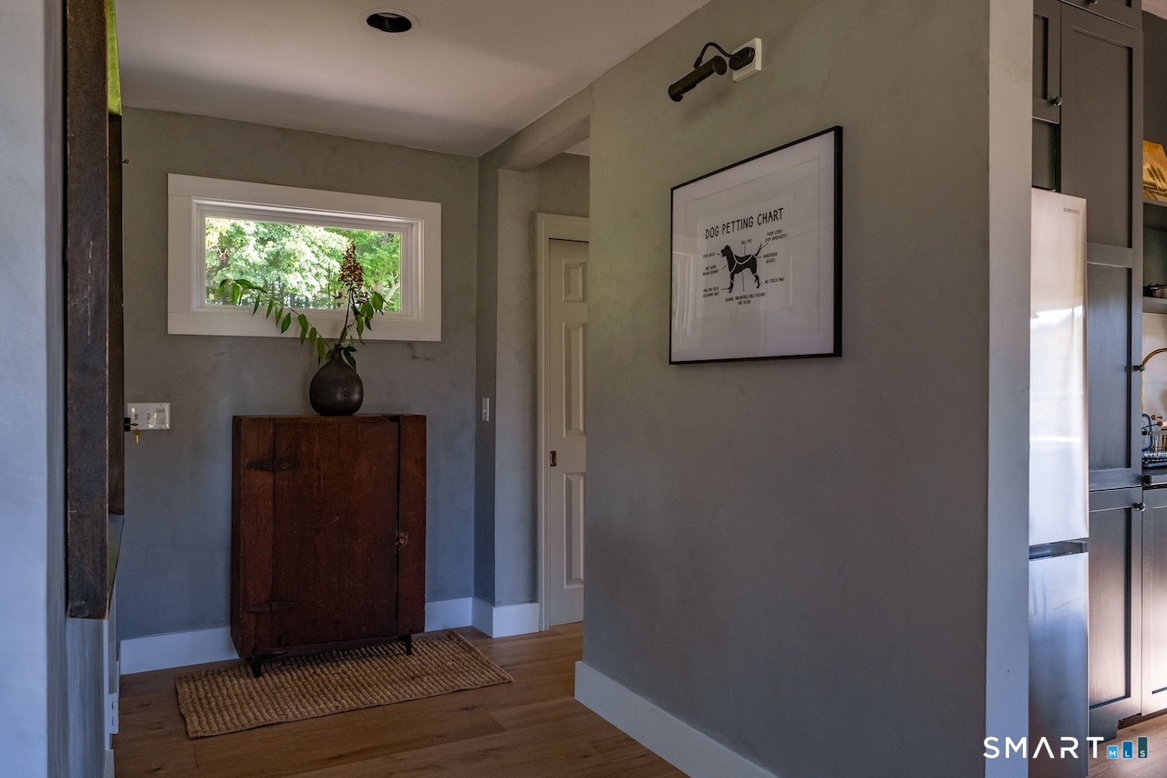 69 Mudge Pond Road Sharon, CT 06069 - Photo 12 of 28 an entryway to room with wooden floor and hallway