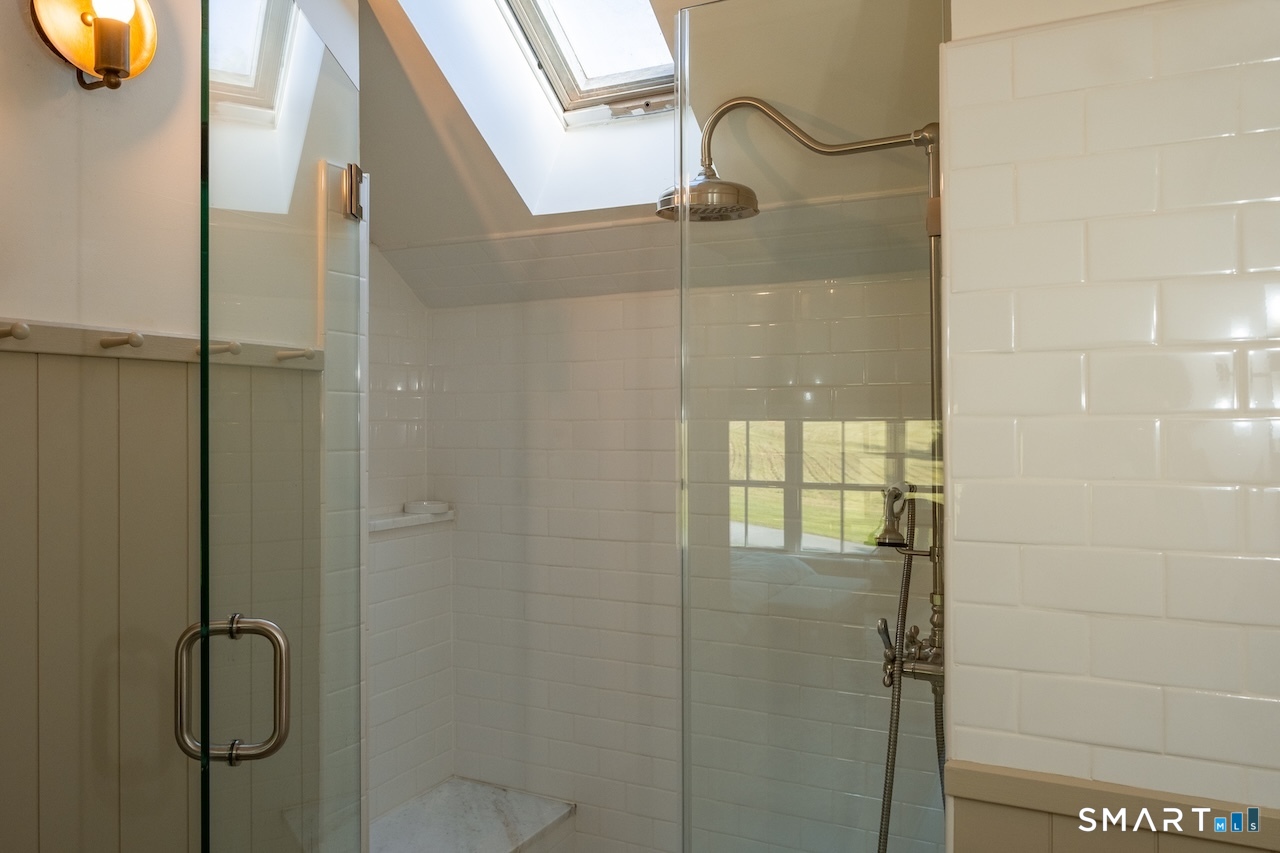 69 Mudge Pond Road Sharon, CT 06069 - Photo 19 of 28 a bathroom with a glass shower door