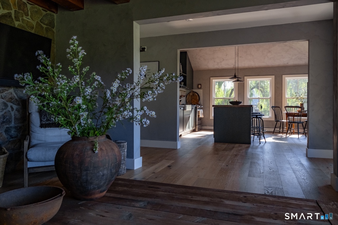 69 Mudge Pond Road Sharon, CT 06069 - Photo 2 of 28 a view of a living room and entryway with furniture