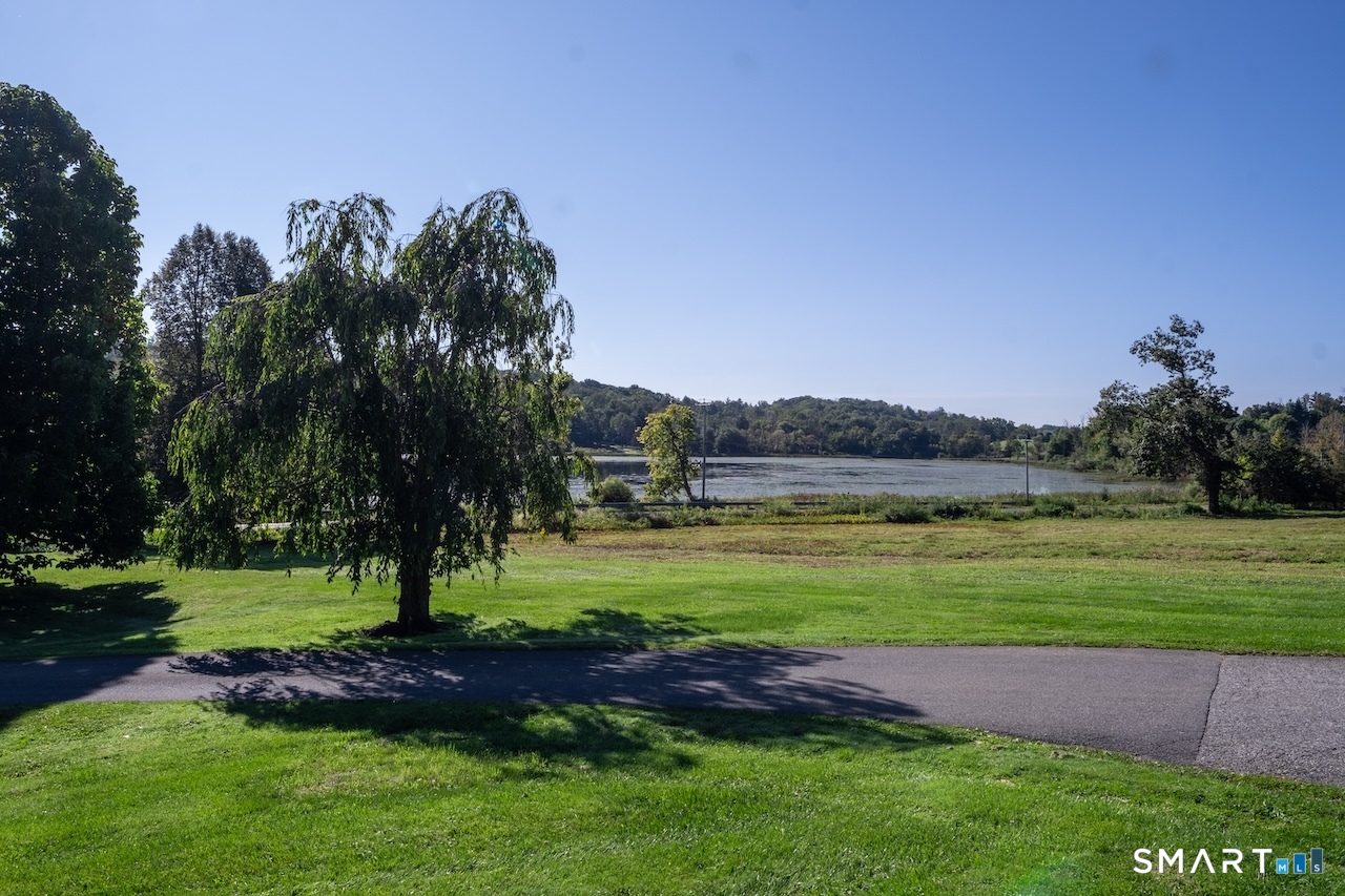 69 Mudge Pond Road Sharon, CT 06069 - Photo 21 of 28 a view of a grassy field with trees around