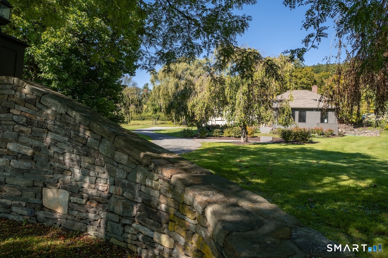 69 Mudge Pond Road Sharon, CT 06069 - Photo 22 of 28 a view of yard with green space and trees