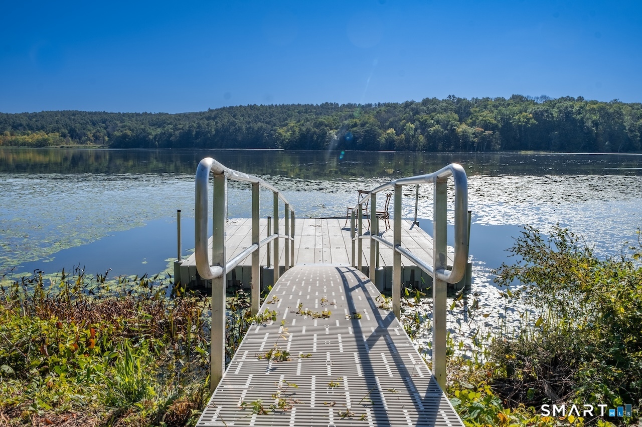 69 Mudge Pond Road Sharon, CT 06069 - Photo 25 of 28 a view of a lake with a mountain in the background