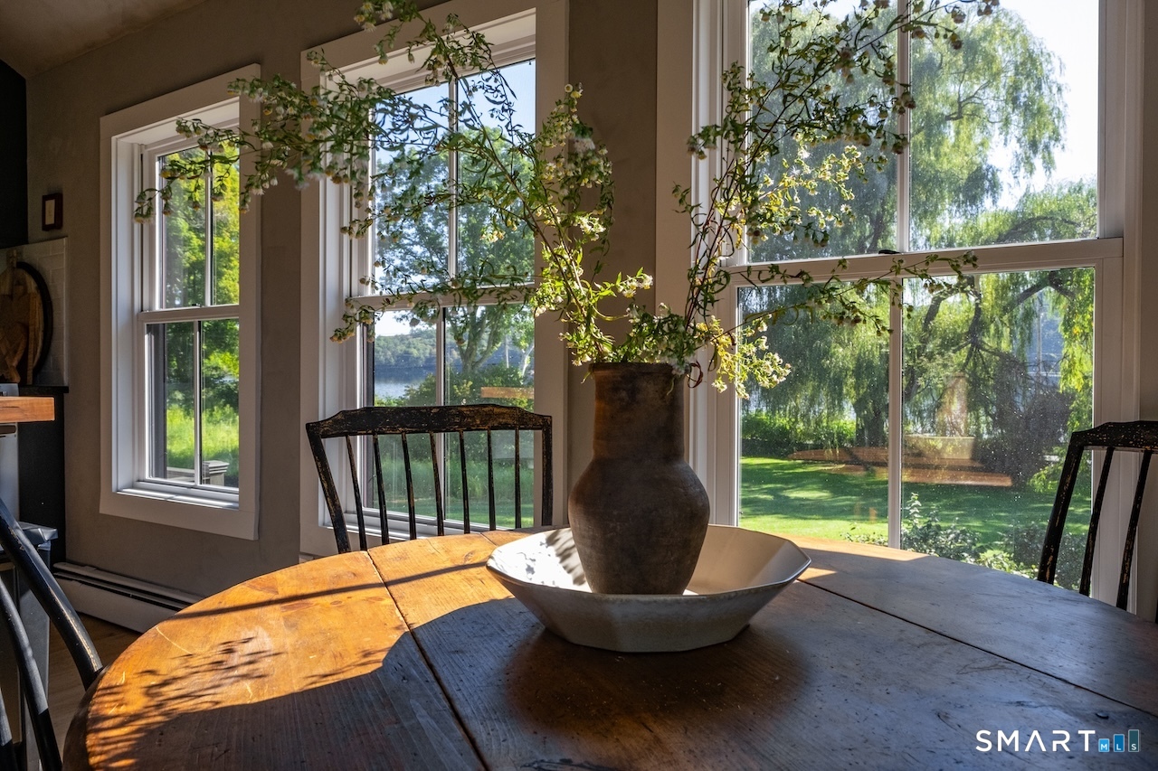 69 Mudge Pond Road Sharon, CT 06069 - Photo 10 of 28 a view of a porch with furniture and wooden floor