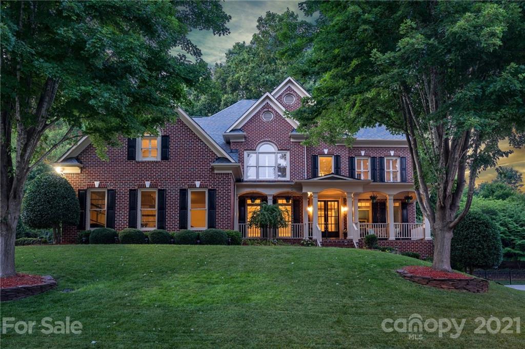 1111 Lytton Lane Matthews, NC 28104 - Photo 1 of 48 a front view of a house with garden