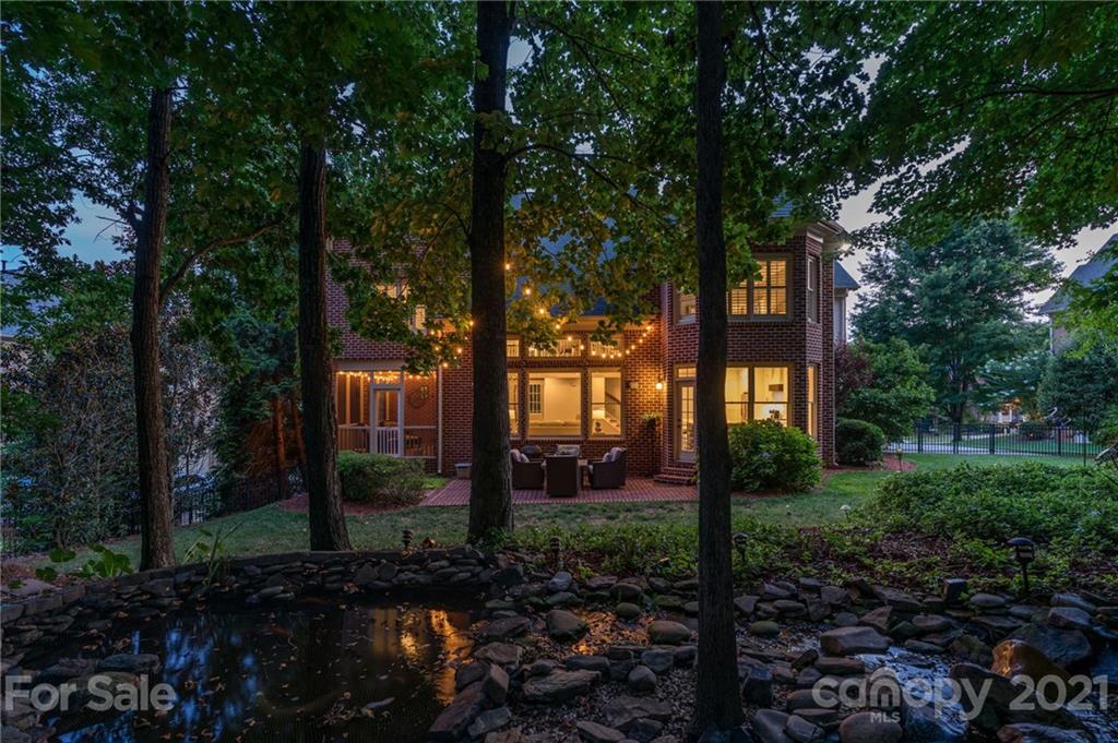 1111 Lytton Lane Matthews, NC 28104 - Photo 2 of 48 a view of a house with backyard and trees