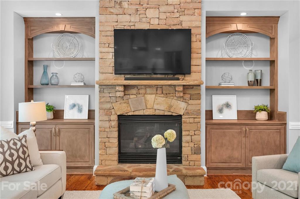 1111 Lytton Lane Matthews, NC 28104 - Photo 13 of 48 a living room with fireplace and a flat screen tv